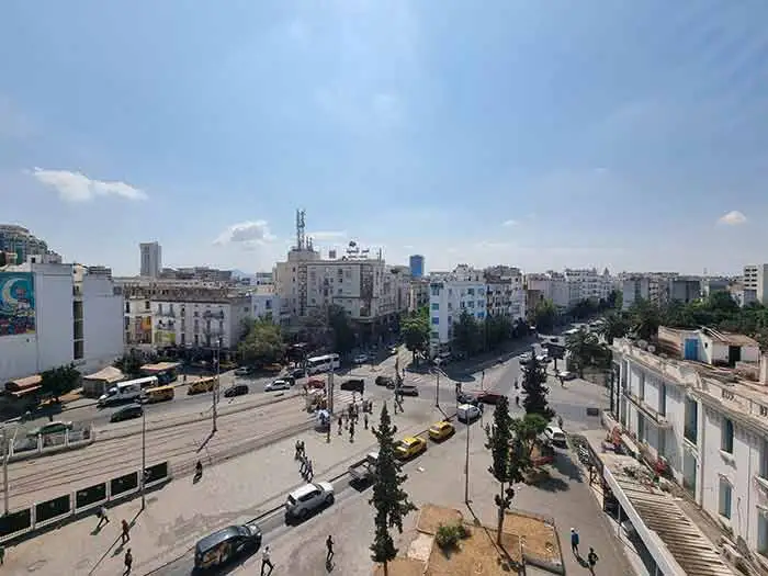 top view of downtown of Tunis, we can see taxis, cars, persons walks, tram railway